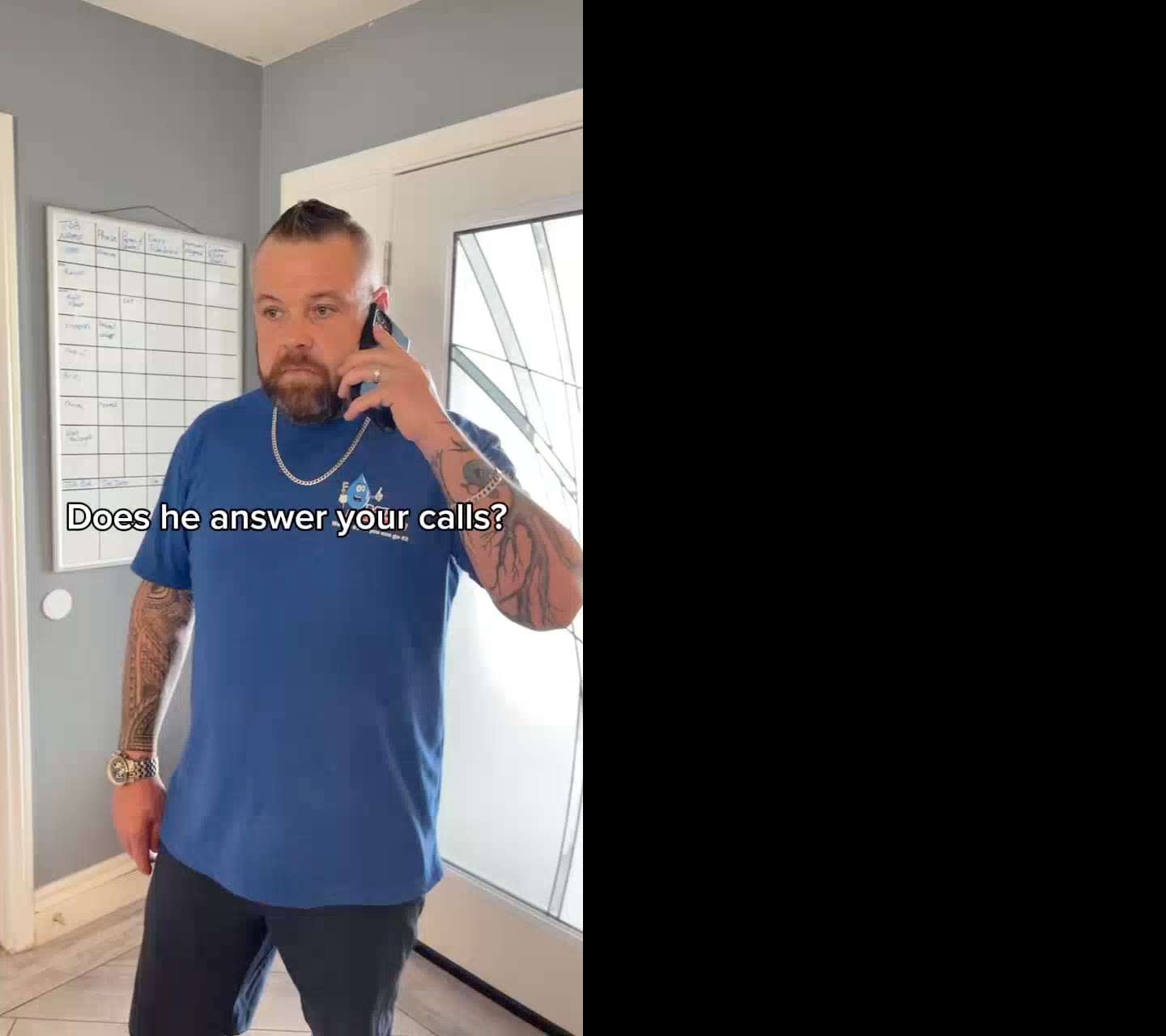 An MC Plumbing crew member taking a phone call.